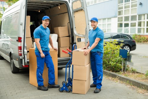 Packed storage boxes and furniture in a clean Snaresbrook storage unit